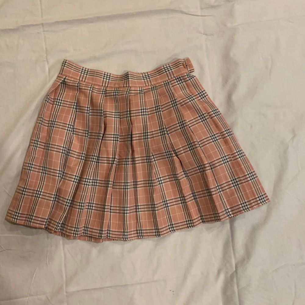Beautifully pleaded.   14 inches FROM waistline down